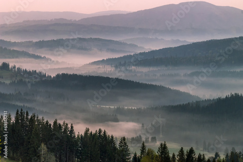 Fog in the mountains at sunrise © new_punisher