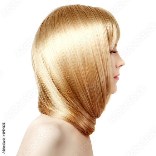 Hair. Beauty young woman with luxurious long blond hair. Girl wi