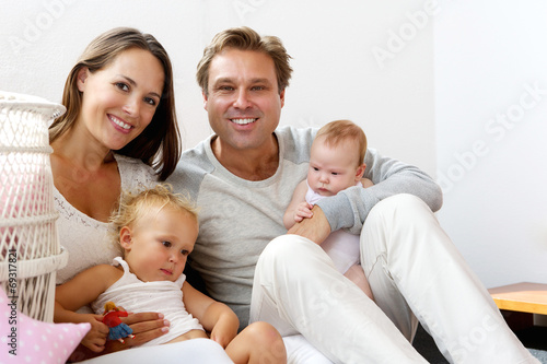 Happy family smiling with children