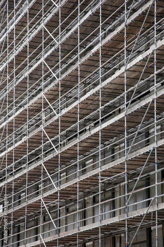 scaffolding on facade of high rise building