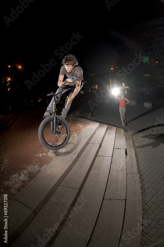 Fototapeta Naklejka Na Ścianę i Meble -  BMX rider performing air trick 