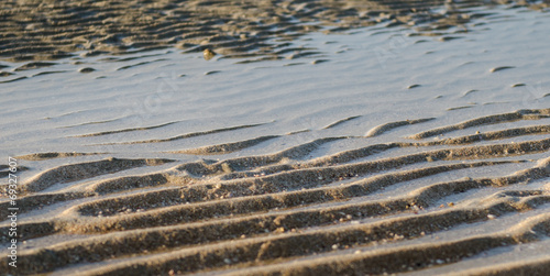 little water on ridge sand on the beach