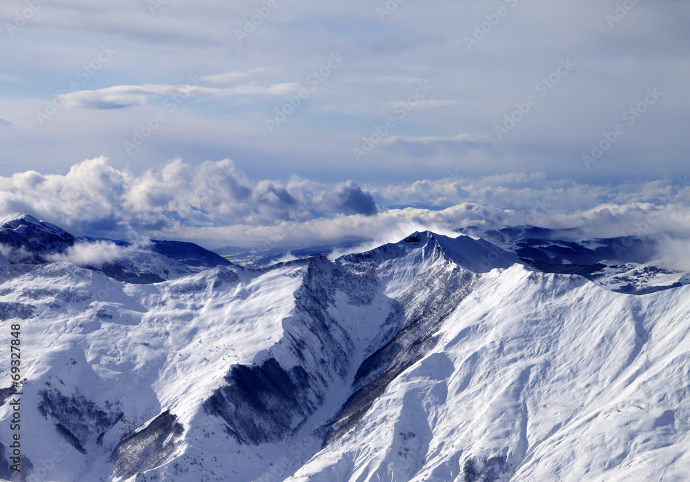 Winter mountains in mist at windy day Winter mountains in mist at windy day