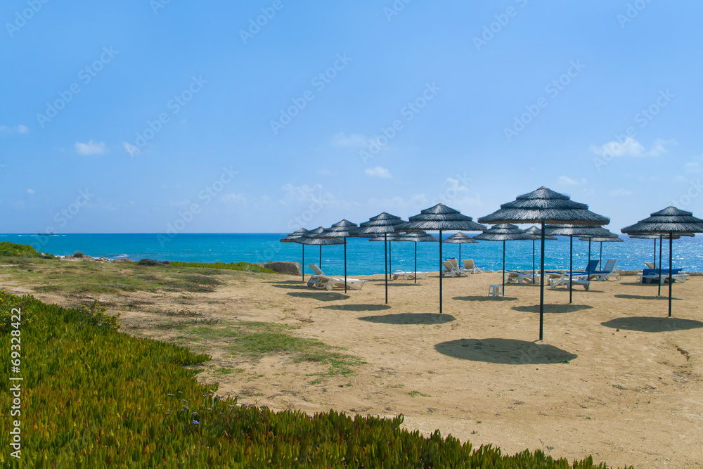 straw umbrellas on beach