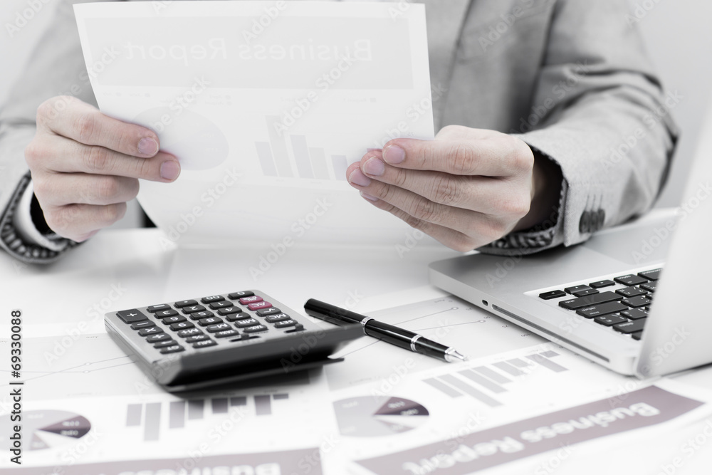 Businessman analyzing investment charts with laptop. Accounting Businessman analyzing investment charts with laptop. Accounting