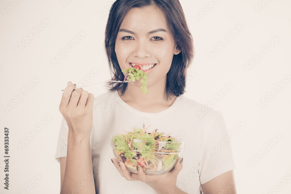 Pretty girl eating fresh vegetable salad Pretty girl eating fresh vegetable salad