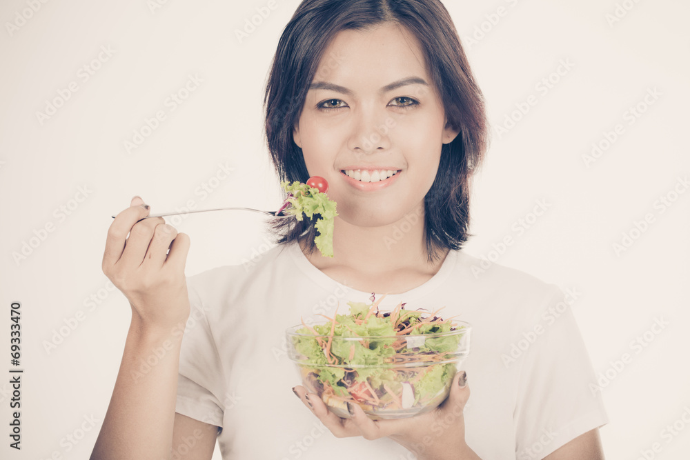 Pretty girl eating fresh vegetable salad Pretty girl eating fresh vegetable salad