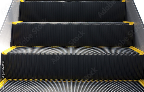 Escalator in close-up shot .Stairs are  rowed or lined things.