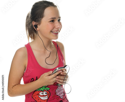 Happy young girl enjoying her music photo