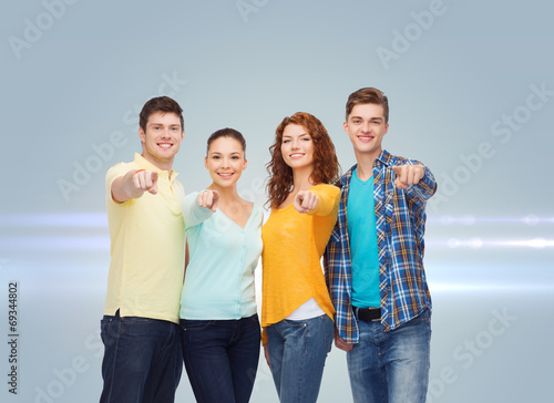 group of smiling teenagers pointing fingers on you © Syda Productions