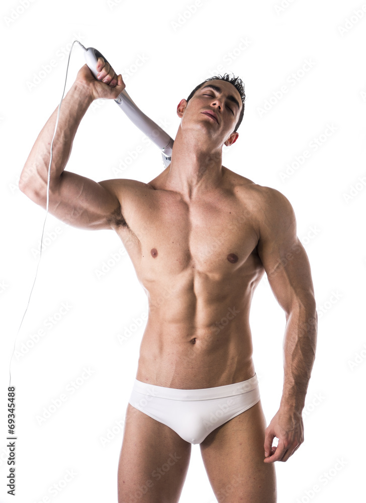 Sexy Man in White Brief Holding Massage Device Sexy Man in White Brief Holding Massage Device