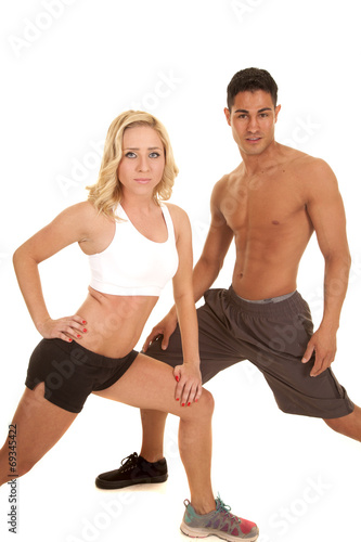 couple stretch both lunge looking