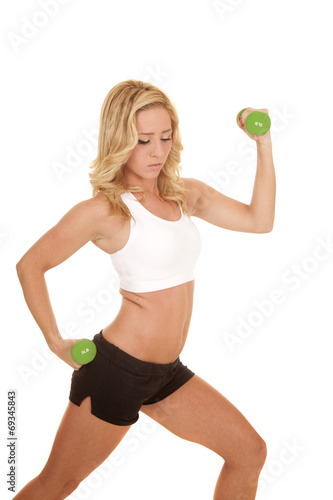 woman white sports bra lunge hold weights
