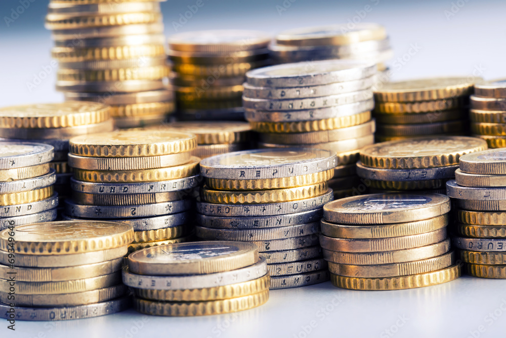 Euro coins on pile of other coins in background.Macro Euro coins on pile of other coins in background.Macro