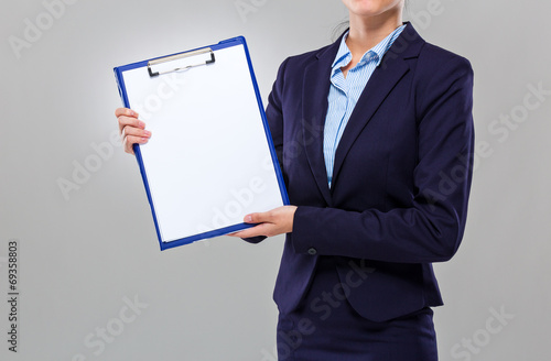 Businesswoman show with blank clipboard