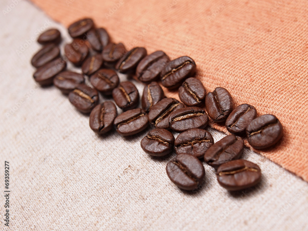 coffee crop beans on fabric textile texture background coffee crop beans on fabric textile texture background