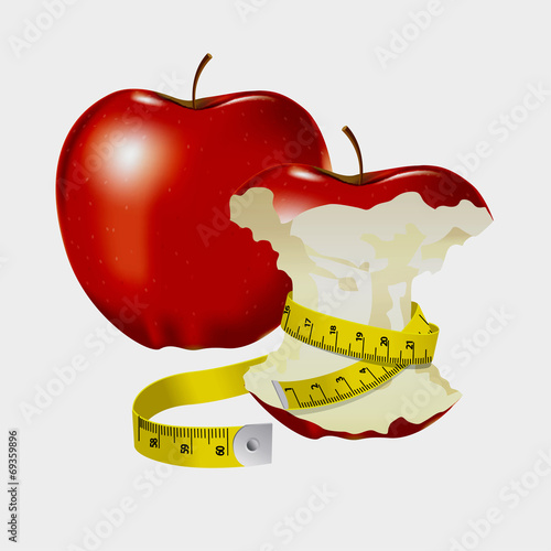 Measuring tape wrapped around red apple as a symbol of diet.