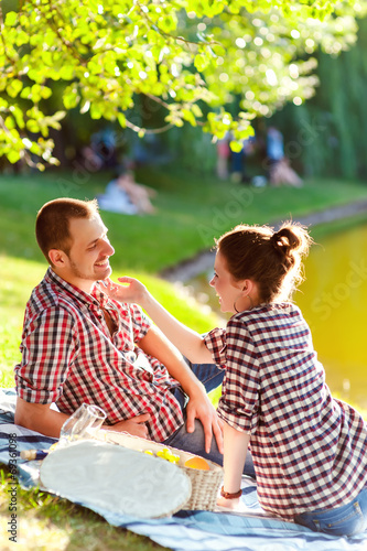 happy young couple enjoying picnic. Toned image