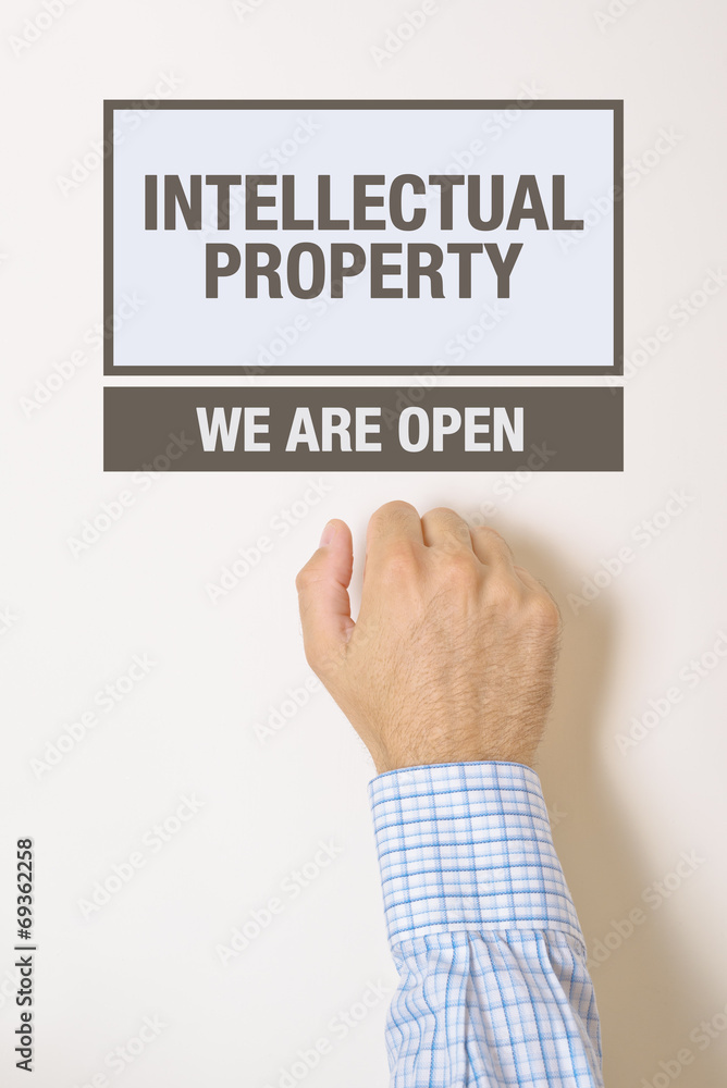 Businessman knocking on Intellectual Property Office door Businessman knocking on Intellectual Property Office door