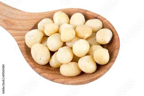 macadamia nuts in a wooden spoon