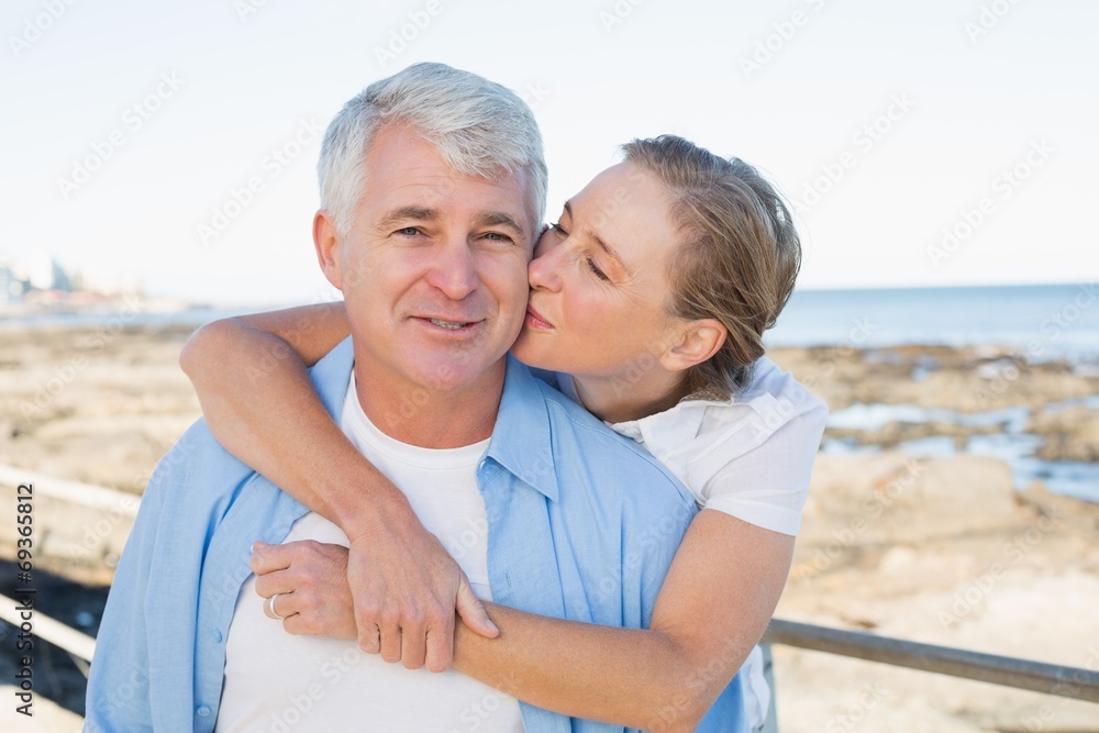 Casual couple having fun by the sea Casual couple having fun by the sea