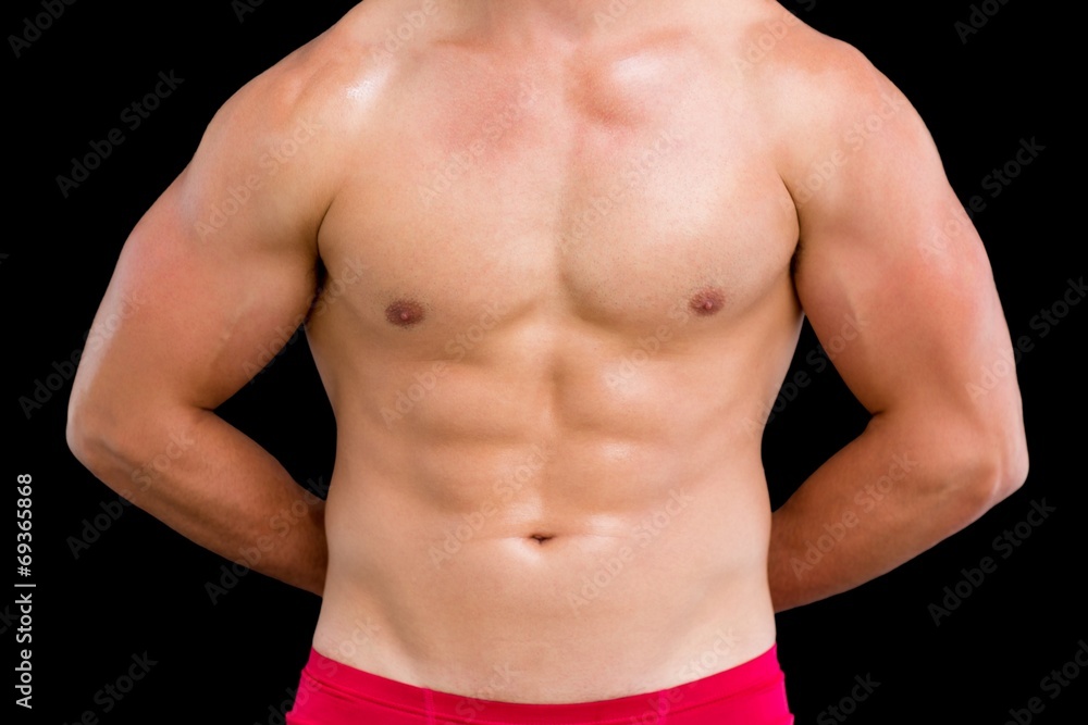 Close-up mid section of a shirtless muscular man