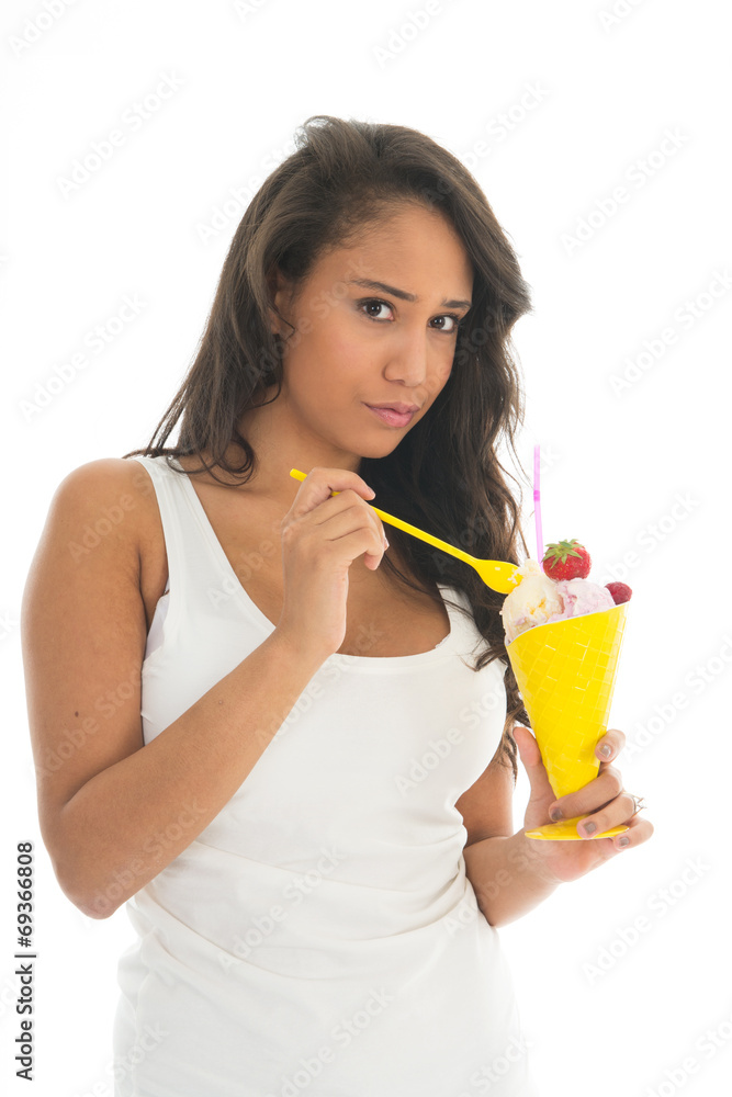 Black woman eating fruit sorbet in glass Black woman eating fruit sorbet in glass