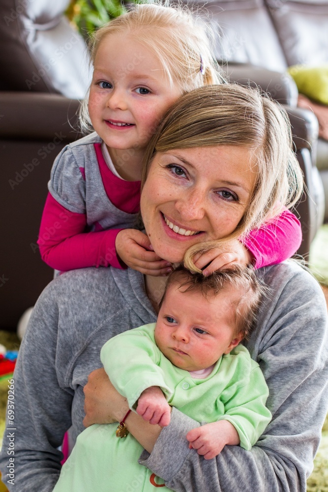 Mother holding newborn girl