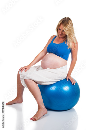 Pregnant woman with blue ball