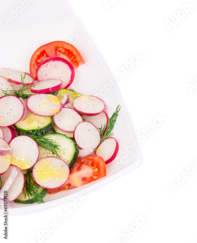 Radish salad with tomatoes and cucumbers.