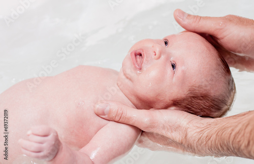 bathing baby in the bath