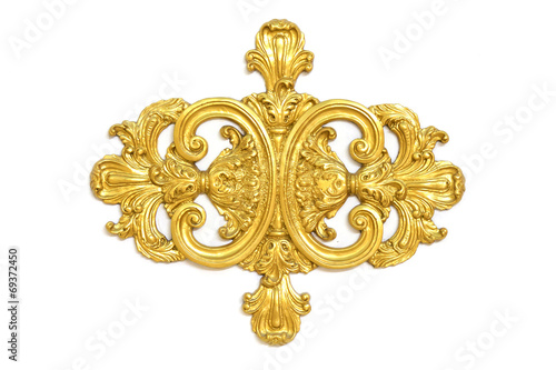 of an ancient gold ornament on a white background