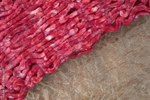 red minced meat on brown paper bag background