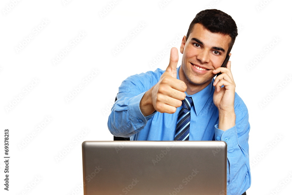 Young businessman in blue shirt colling and shows thumbs up Young businessman in blue shirt colling and shows thumbs up