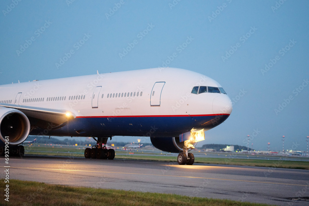 Passenger planes at the airport in the evening Passenger planes at the airport in the evening