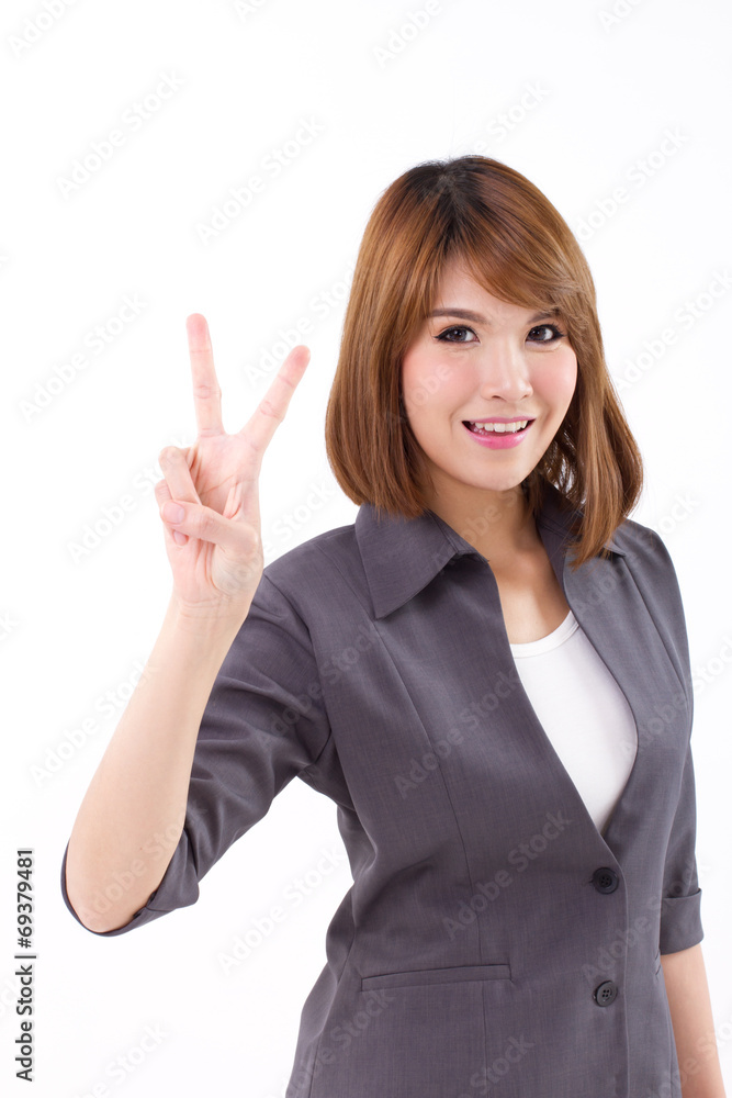 Happy, beautiful, smiling business woman showing victory V Happy, beautiful, smiling business woman showing victory V
