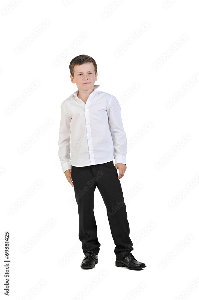 Foto Stock a little boy 7 years old, in a white shirt and black pants with  | Adobe Stock