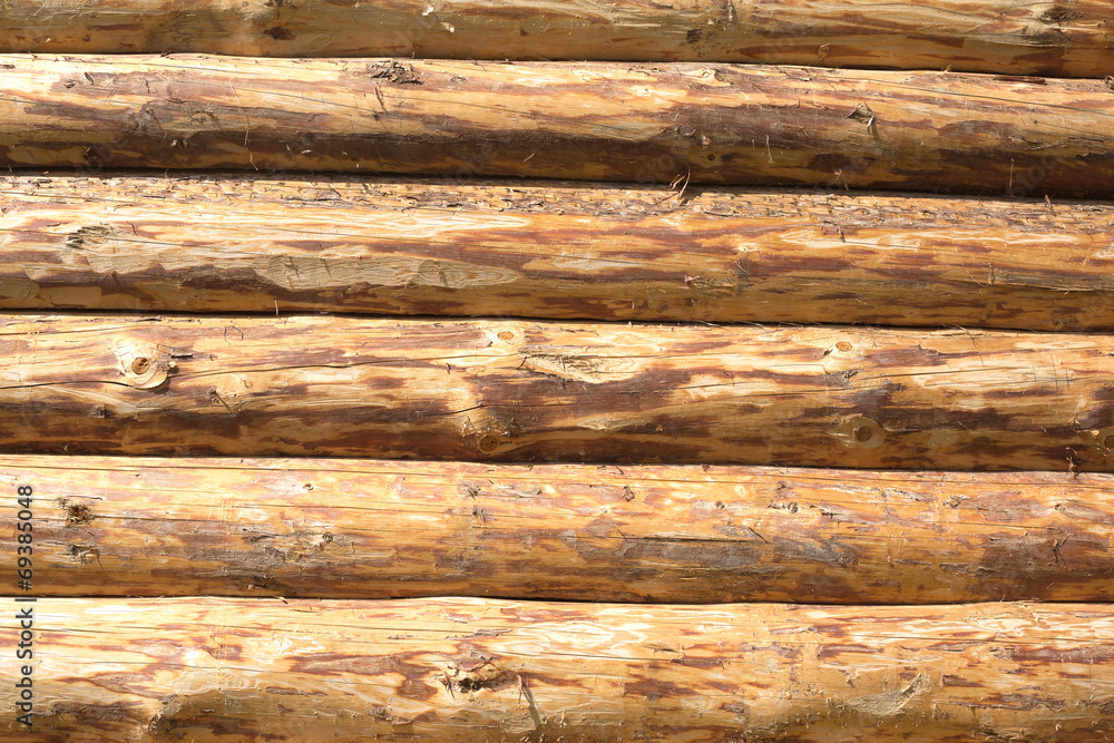 The walls of a house from planed horizontal logs as background The walls of a house from planed horizontal logs as background