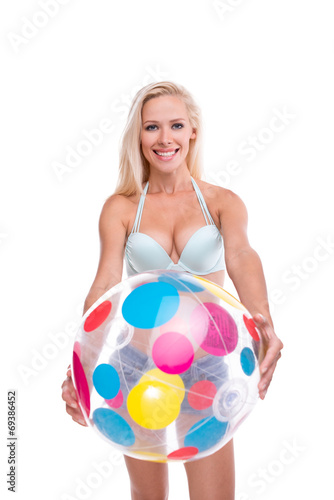 Happy woman with beach ball, isolated © Friends Stock