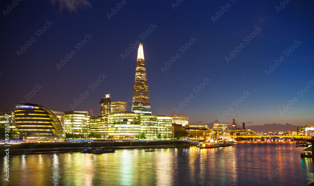 Shard of glass in night lights, view from the Tower bridge Shard of glass in night lights, view from the Tower bridge