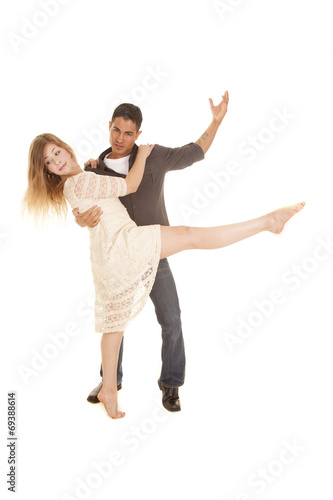 woman in white dress dance with man leg out