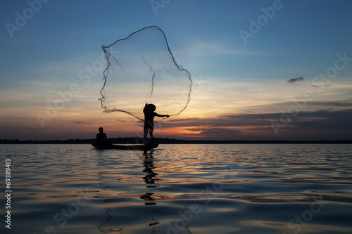 Fisherman silhouette at sunset