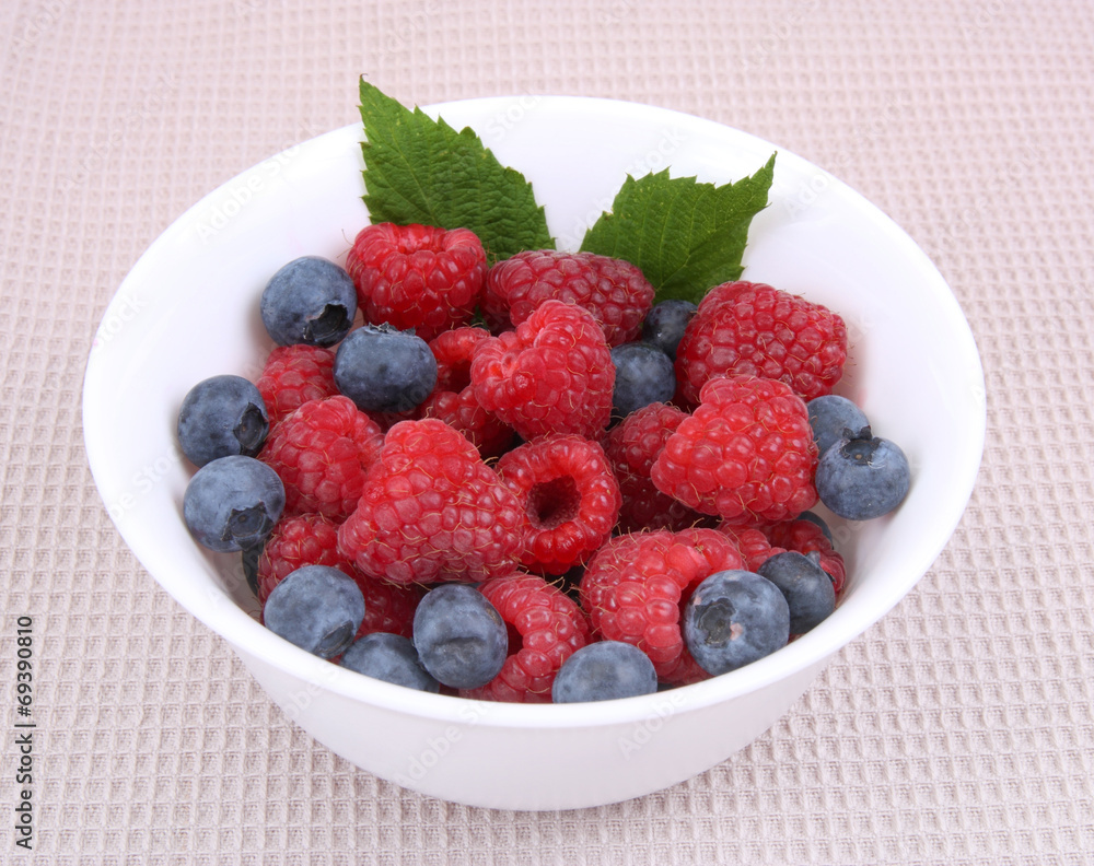 fresh raspberries and berry on a bowl fresh raspberries and berry on a bowl