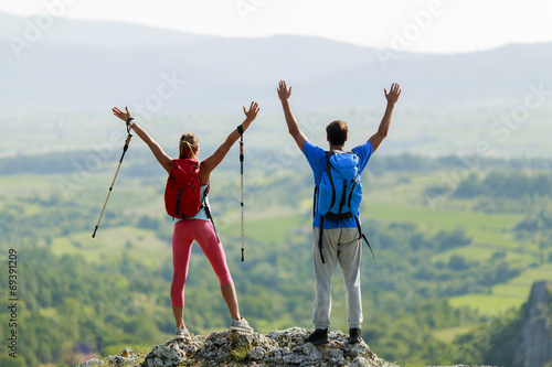 Young couple hiking on the ...