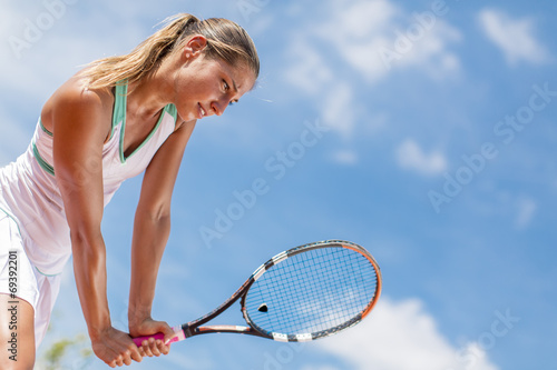 Young woman playing tennis