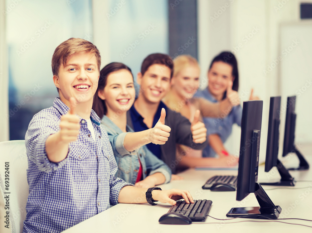 students with computer monitor showing thumbs up