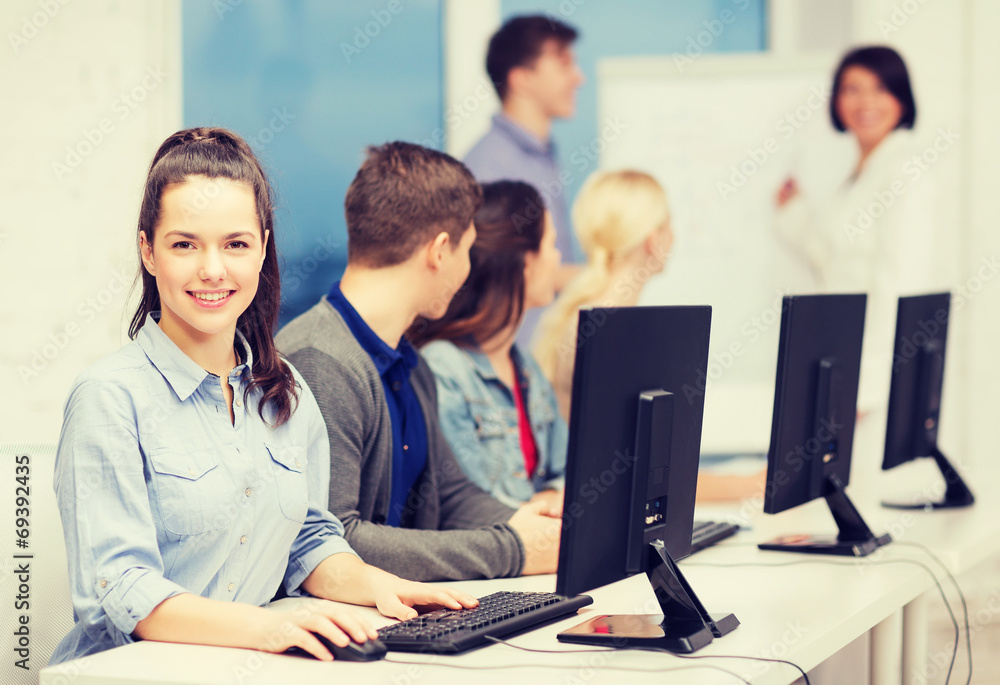 Obraz premium students with computer monitor at school