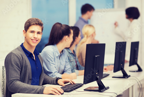 students with computer monitor at school