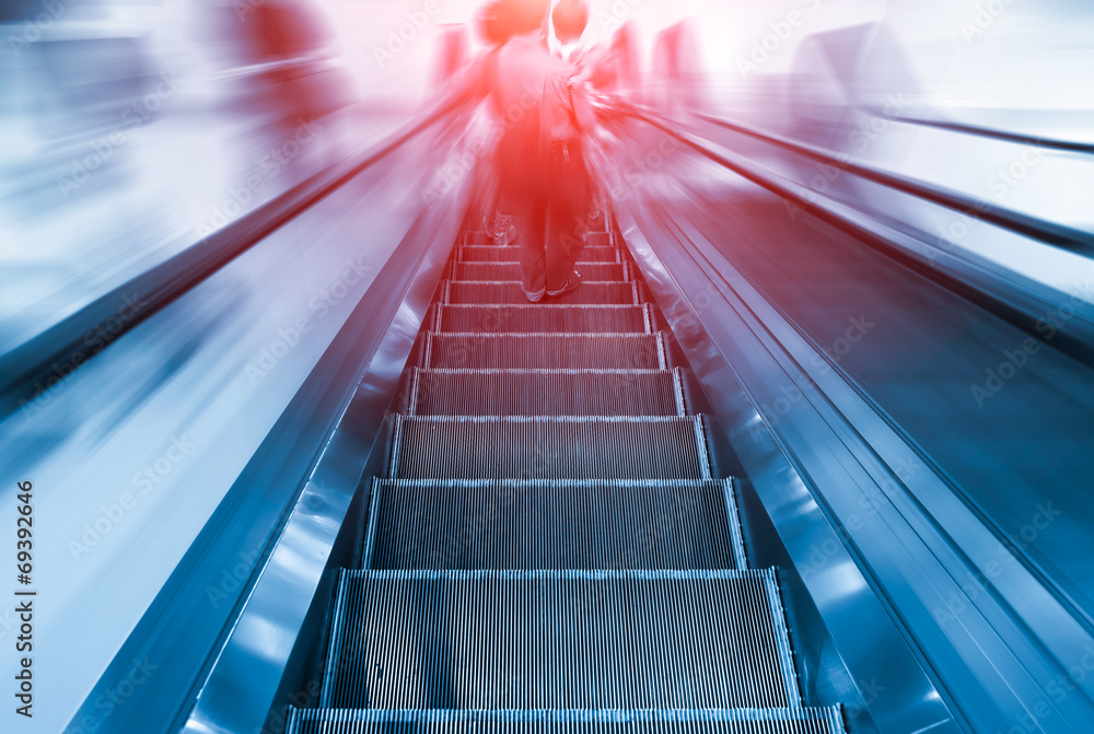 Empty escalator or moving stair. Also called stairway or staircase. Modern architecture design with step, glass for lift people up floor building i.e. shopping mall, airport, metro and subway station. Empty escalator or moving stair. Also called stairway or staircase. Modern architecture design with step, glass for lift people up floor building i.e. shopping mall, airport, metro and subway station.