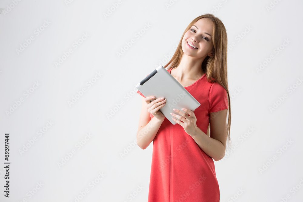 Happy brunette woman holding tablet Happy brunette woman holding tablet